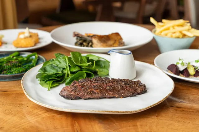 Grass-fed bavette steak with greens and fries
